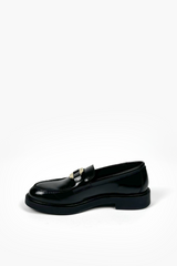 Leather moccasin with metal buckle