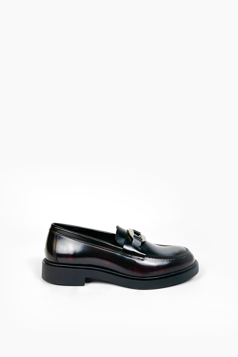 Leather moccasin with metal buckle